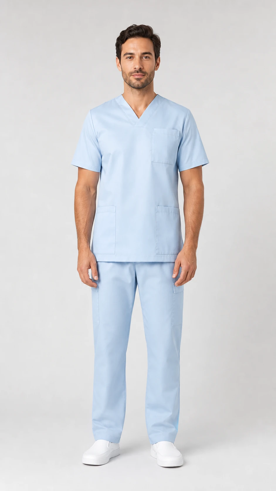 Completo sanitario azzurro unisex indossato da un professionista
